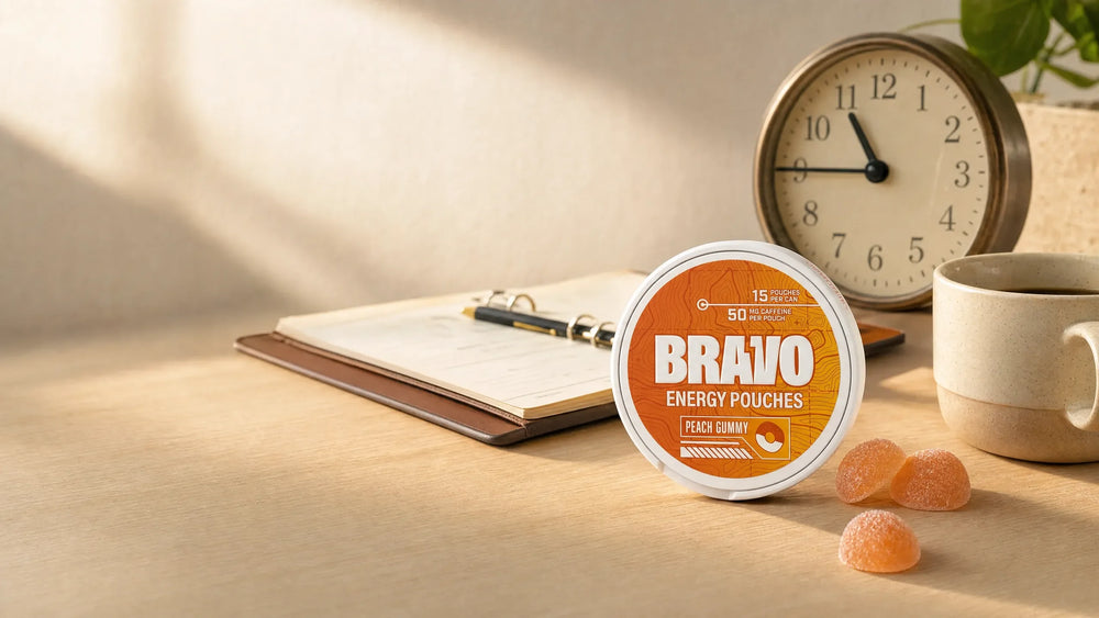 Bravo Peach Gummy caffeine pouch can on a desk beside an analog clock, planner, and peach gummies