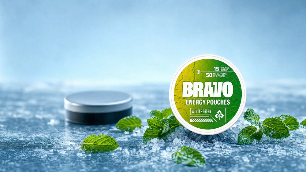Bravo Wintergreen caffeine pouch can in the foreground with an unbranded competitor tin softly blurred in the background, editorial hero for the Rivox Labs Focus Pouches review