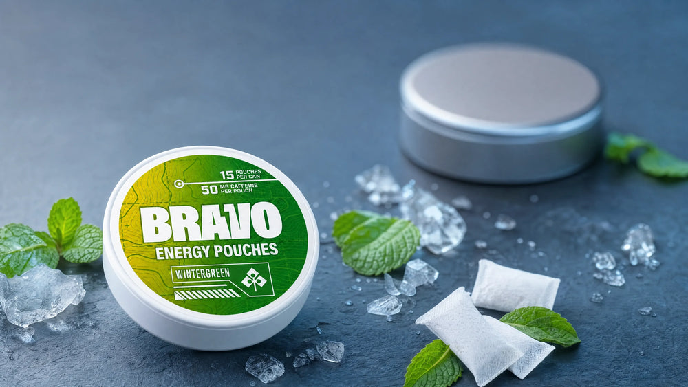 Bravo Wintergreen caffeine pouch can, sharp focus, on a cool slate surface with mint leaves and ice, hero image for Cannadips Brain Fuel comparison review