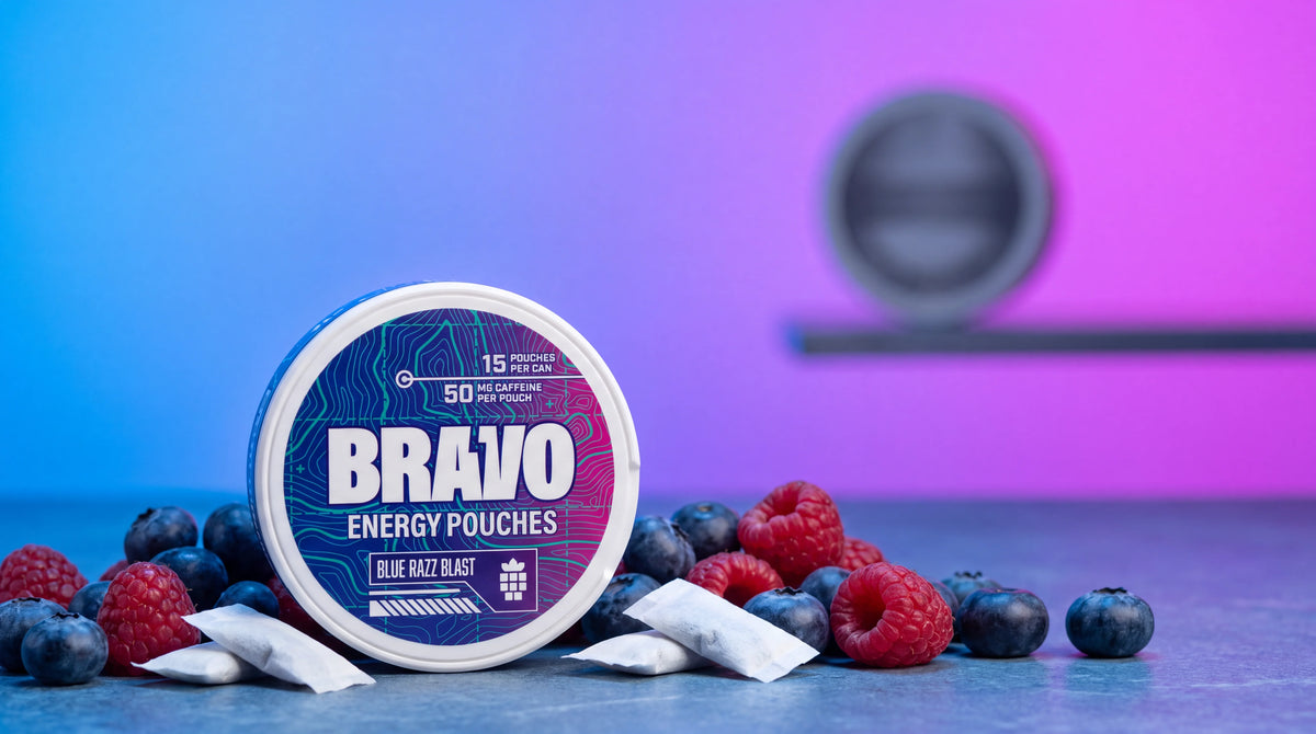 Bravo Blue Razz Blast caffeine pouch can with blueberries and raspberries, blurred competitor tin in background