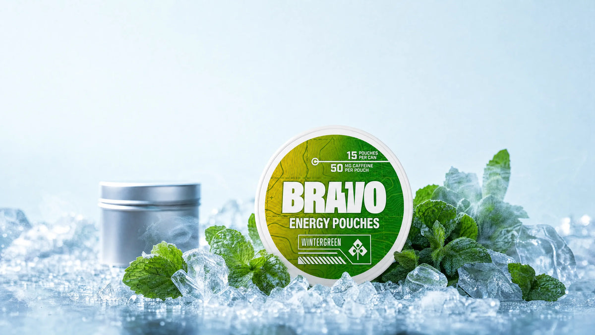 Bravo Wintergreen caffeine pouch can with mint leaves and frost, CaffPack comparison hero